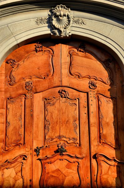 Wooden Door Facing Münsterplatz in Basel, Switzerland - Encircle Photos