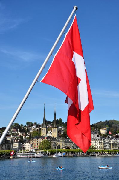 Rectangular Swiss Flag Flying over Lake Lucerne in Lucerne, Switzerland - Encircle Photos
