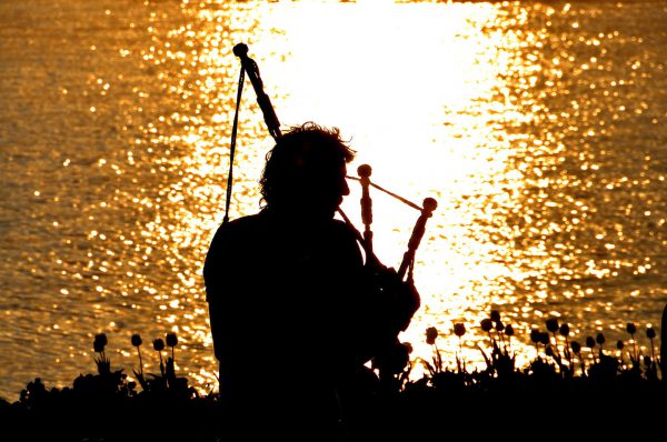 Bagpiper Silhouette at Sunset in Zurich, Switzerland - Encircle Photos