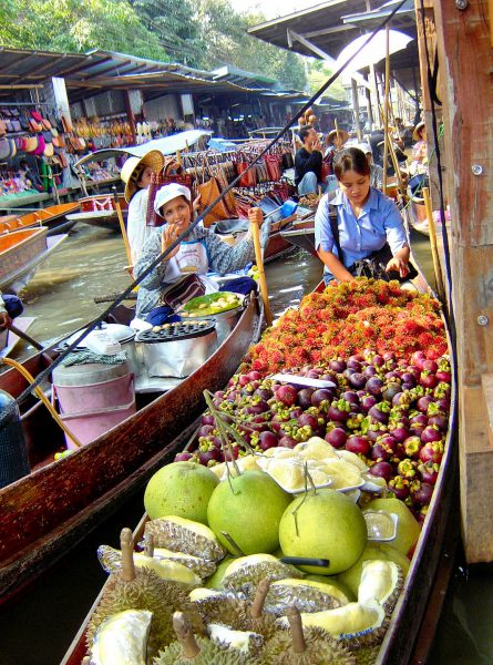 Woman Selling Fruit at Floating Market in Amphawa, Thailand - Encircle Photos