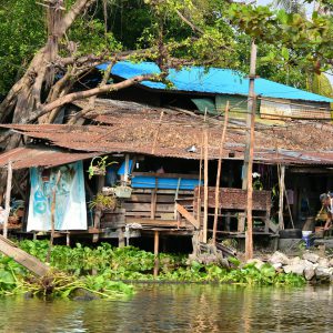 Rickety Hut on Canal in Bangkok, Thailand - Encircle Photos