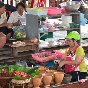 Woman Preparing Food at Taling Chan Floating Market near Bangkok, Thailand - Encircle Photos