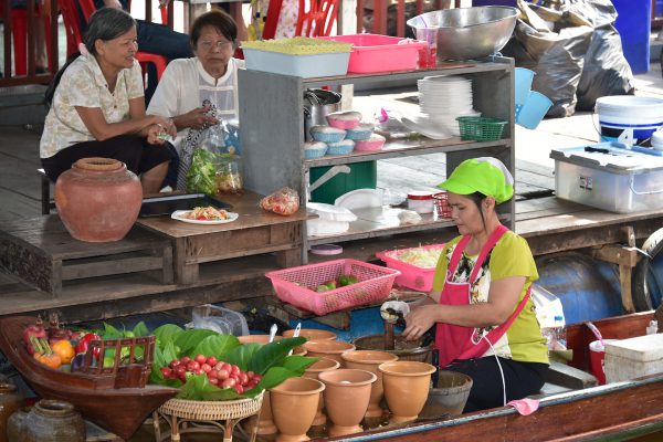 Woman Preparing Food at Taling Chan Floating Market near Bangkok, Thailand - Encircle Photos