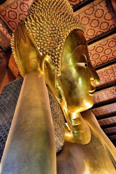 Close Up of Reclining Buddha Face at Wat Pho in Bangkok, Thailand - Encircle Photos