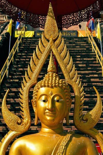 Golden Buddha with Halo at Wat Chedi Luang in Chiang Mai, Thailand - Encircle Photos