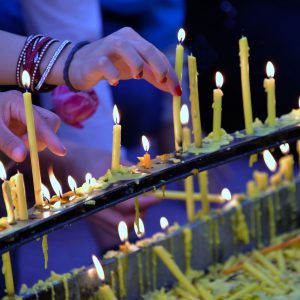 Lighting Candles at Wat Doi Suthep in Chiang Mai, Thailand - Encircle Photos