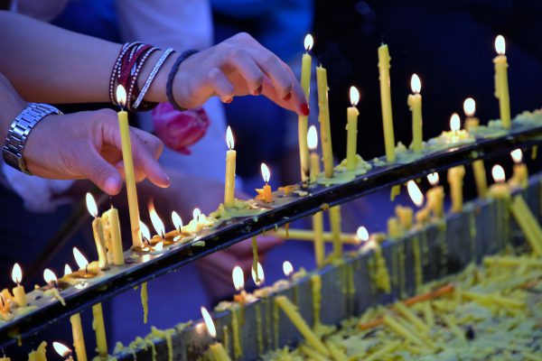 Lighting Candles at Wat Doi Suthep in Chiang Mai, Thailand - Encircle Photos