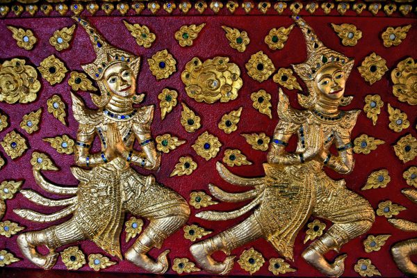 Golden Female Dancers Relief at Wat Suan Dok in Chiang Mai, Thailand - Encircle Photos