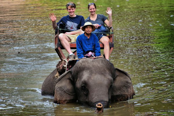 Tourists Riding Elephant in Water in Hang Chat, Thailand - Encircle Photos