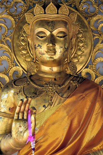 Buddha with Halo at Wat Phra That Hariphunchai in Lamphun, Thailand - Encircle Photos