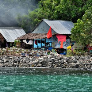 Villager Doing Laundry at Nui Bay on Phi Phi Don, Thailand - Encircle Photos