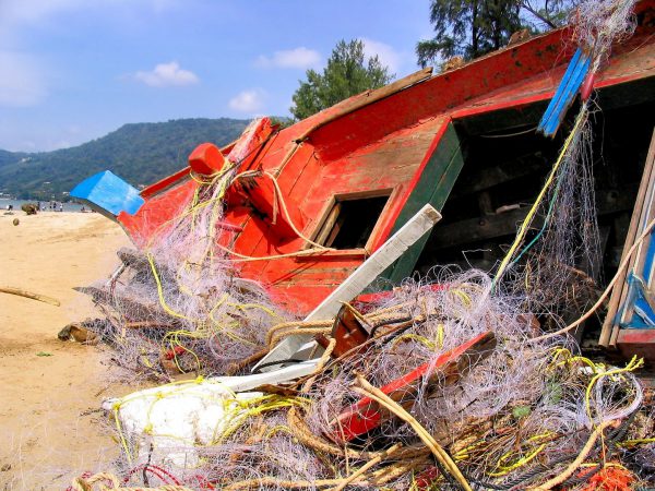 Destroyed Fishing Boat and Tangled Nets After Tsunami on Patong Beach in Phuket, Thailand - Encircle Photos