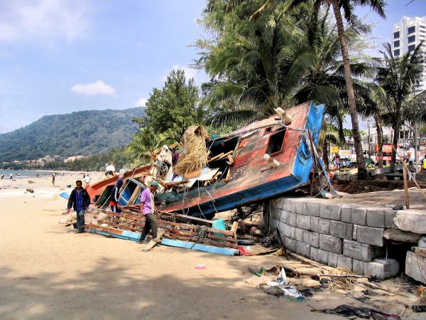 Destroyed Fishing Boat Teetering on Ledge After Tsunami on Patong Beach in Phuket, Thailand - Encircle Photos