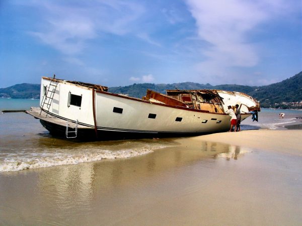 Destroyed Yacht Washed on Shore After Tsunami on Patong Beach in Phuket, Thailand - Encircle Photos