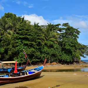 Longtail Boat Beached on Kamala Beach in Phuket, Thailand - Encircle Photos