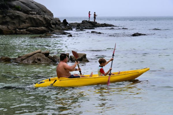 Father and Son Kayaking at Kata Beach in Phuket, Thailand - Encircle Photos