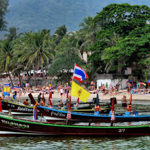 Three Longtail Boats Anchored at Kata Beach in Phuket, Thailand - Encircle Photos