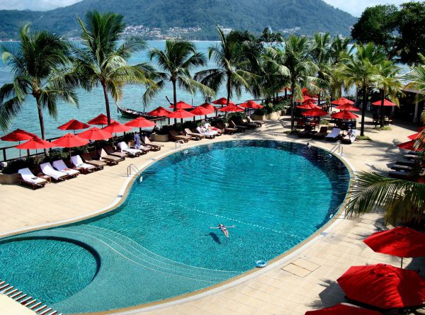 Girl Floating in Pool at Amari Hotel in Patong Beach in Phuket, Thailand - Encircle Photos