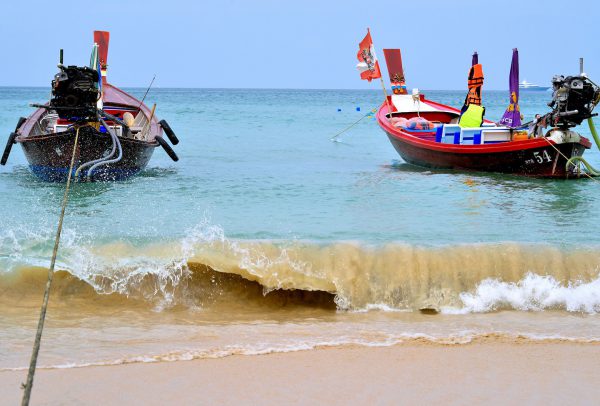 Two Longtail Boats Near Shore of Patong Beach in Phuket, Thailand - Encircle Photos