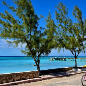 Cycling on Front Street in Cockburn Town, Grand Turk, Turks and Caicos Islands - Encircle Photos