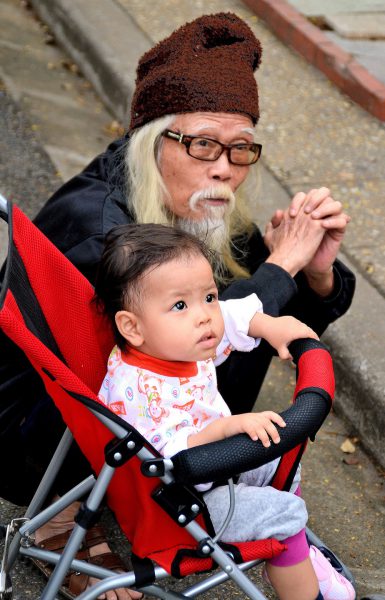 Old Bearded Man with Infant in Stroller in Hanoi, Vietnam - Encircle Photos
