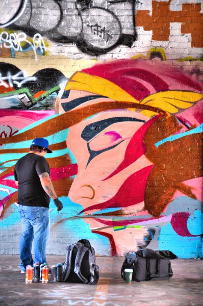 Mural Artist Painting in Graffiti Garage in Tacoma, Washington - Encircle Photos